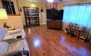 Living area featuring hardwood / wood-style flooring
