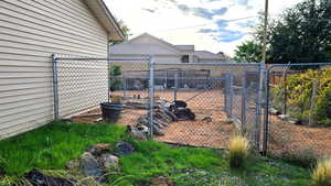 View of yard with dog run area.