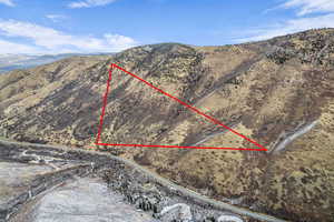 View of property location with property parcel outlined and a mountain backdrop