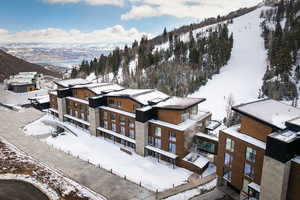 Snowy aerial view featuring a mountain view