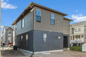 Rear view of property featuring stucco siding