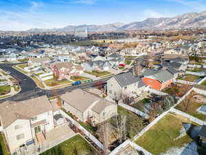 Aerial view of residential area featuring a mountainous background