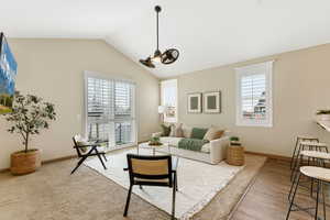 Living room with plenty of natural light and vaulted ceiling