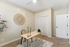 Office featuring light carpet and baseboards