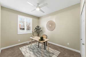 Office featuring carpet and ceiling fan