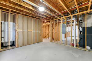 Unfinished basement with electric panel