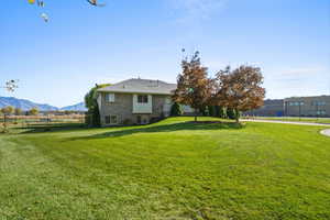 View of yard featuring a mountain view and a view of countryside