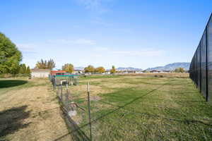 View of yard featuring a mountain view and a view of countryside