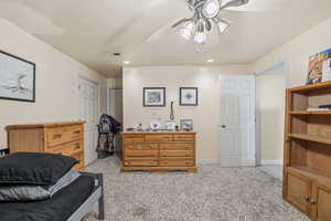 Bedroom featuring a closet, light carpet, ceiling fan, and recessed lighting