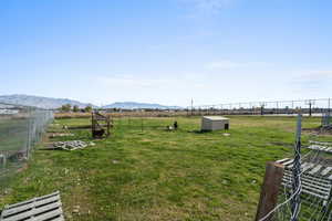 View of yard featuring a view of countryside and a mountain view
