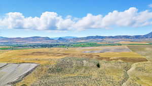 View of mountain background featuring rural landscape