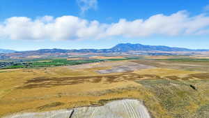 View of mountain background featuring rural landscape