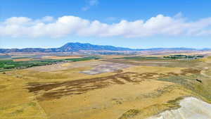 View of mountain backdrop featuring rural landscape