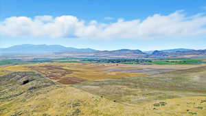 View of mountain background featuring rural landscape