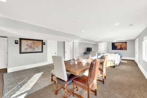 Dining space with carpet and recessed lighting