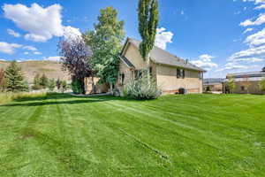 Back of house featuring stucco siding
