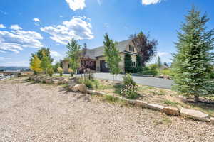 View of front of property featuring driveway and a garage