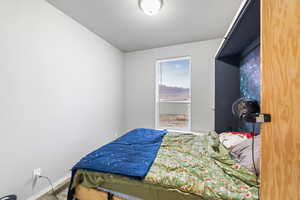 Bedroom featuring baseboards