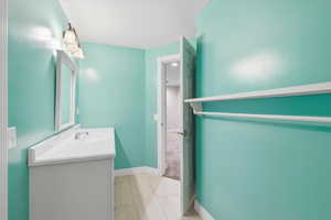 Bathroom featuring vanity and light tile patterned flooring