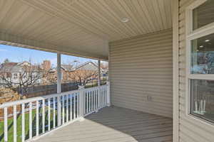 Wooden deck with a residential view