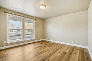 Spare room featuring light wood-type flooring