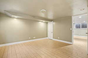 Empty room featuring recessed lighting and wood finish floors