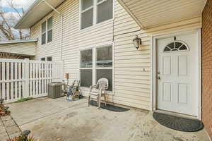 Doorway to property with a patio