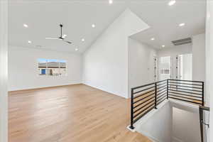 Spare room featuring light wood-style floors, recessed lighting, and ceiling fan