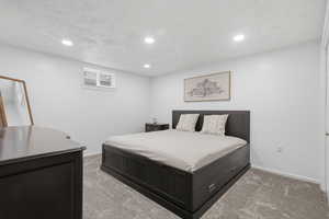Bedroom featuring light carpet and recessed lighting