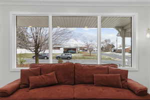 Living area with healthy amount of natural light and a mountain view