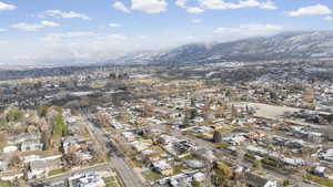 Aerial overview of property's location with nearby suburban area and a mountain backdrop