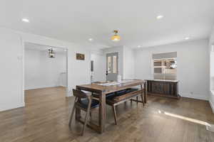 Dining room with hardwood / wood-style flooring, recessed lighting, and ornamental molding