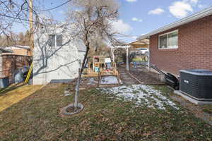 View of yard with a playground and a patio