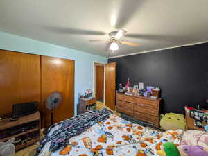 Bedroom featuring a closet and ceiling fan