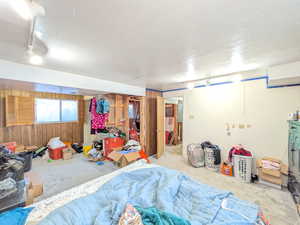 Bedroom with wooden walls