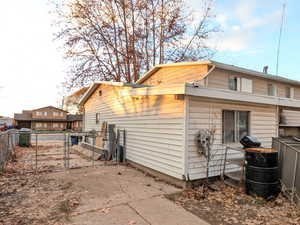 View of home's exterior with a gate