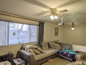 Living area with a ceiling fan
