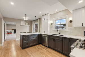 Brand new custom kitchen with gas range, quartz countertops, soft close cabinets, tile back splash and more.