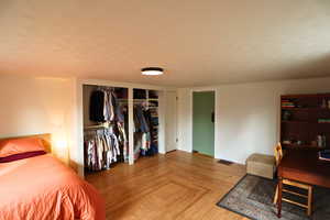 Bedroom featuring a textured ceiling