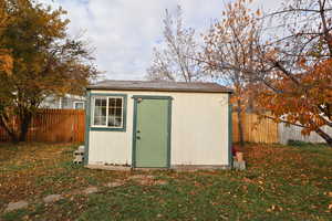 View of shed featuring a fenced backyard