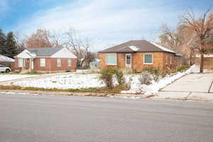 Bungalow-style house featuring brick siding
