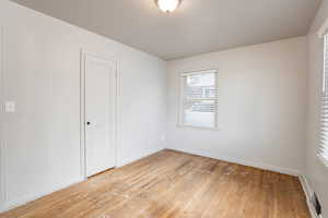 Unfurnished room with light wood-type flooring
