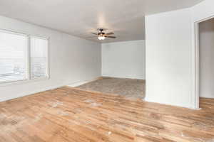 Spare room featuring light wood-type flooring and ceiling fan