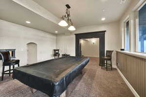 Recreation room with billiards, recessed lighting, and arched walkways