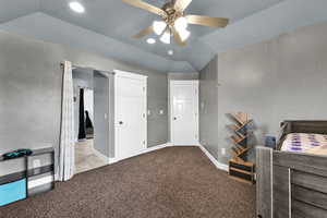 Bedroom with vaulted ceiling, carpet flooring, recessed lighting, a ceiling fan, and arched walkways