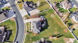 Aerial view of property's location featuring nearby suburban area
