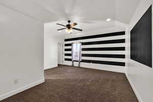 Spare room with recessed lighting, dark carpet, and a ceiling fan