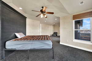 Carpeted bedroom featuring ceiling fan and recessed lighting