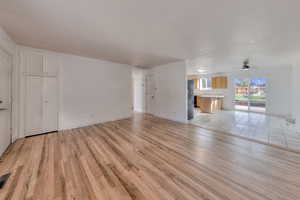 Unfurnished living room with hardwood flooring.