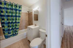 Full bathroom with shower / bath combo.